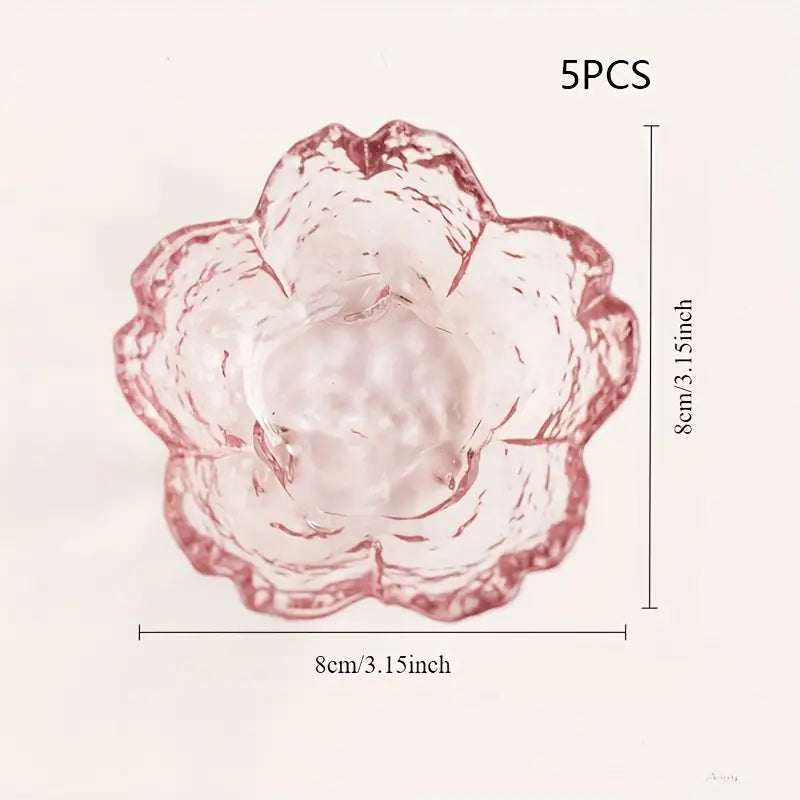 Pink flower-shaped object with measurements on a light pink background