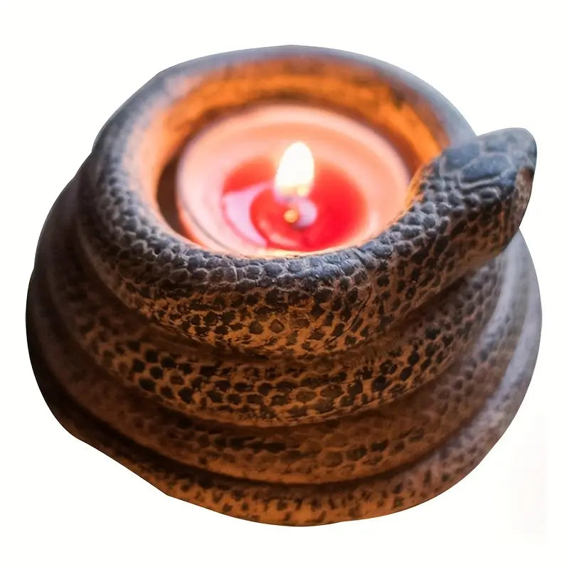Ceramic oil lamp with a lit candle inside on a white background