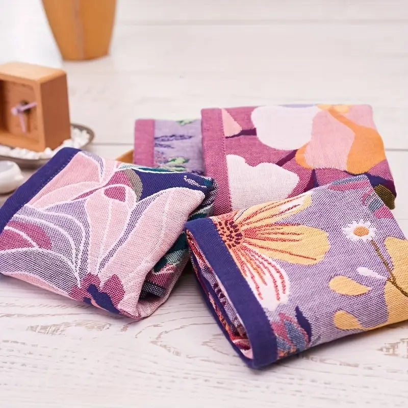 Floral-patterned fabric samples on a wooden surface